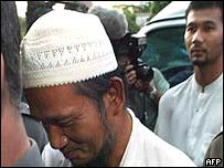 Terrorist suspects Maisuri Haji Abdullah (C) and his son Mayahi Haji Doloh (behind-R), 